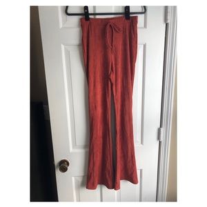 Burnt orange flare pants.